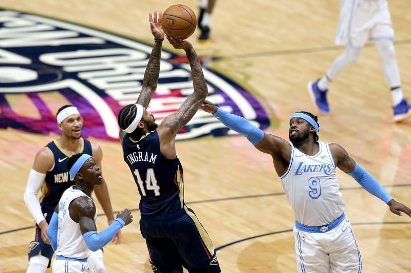 Brandon Ingram #14 shoots over Wesley Matthews #9