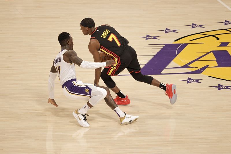 Rajon Rondo #7 of the Atlanta Hawks drives against Dennis Schroder #17 of the Los Angeles Lakers