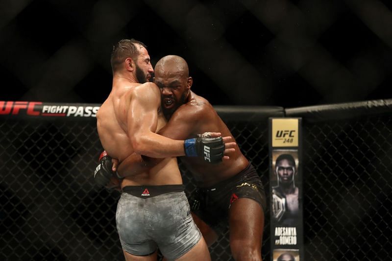 Jon Jones attempts a takedown on Dominick Reyes.