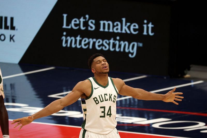 Giannis Antetokounmpo #34 defends on an inbound pass