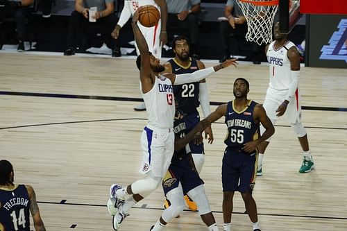 Paul George (#13) of the LA Clippers rises for a dunk against the New Orleans Pelicans.