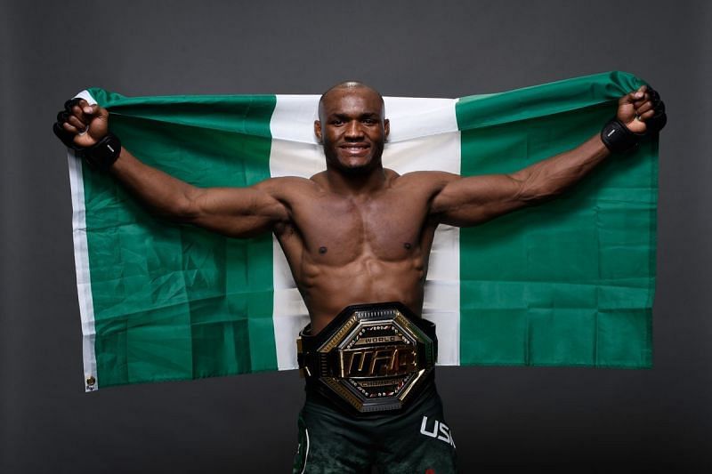 #2 UFC P4P fighter Kamaru Usman with the Nigerian flag and UFC welterweight belt.