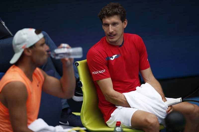 Rafael Nadal (L) and Pablo Carreno Busta