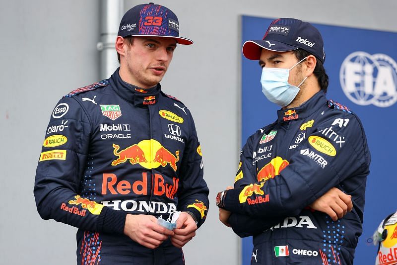 Second place qualifier Sergio Perez of Mexico and Red Bull Racing and third place qualifier Max talk in parc ferme post qualifying, 2021 Imola GP. (Photo by Bryn Lennon/Getty Images)