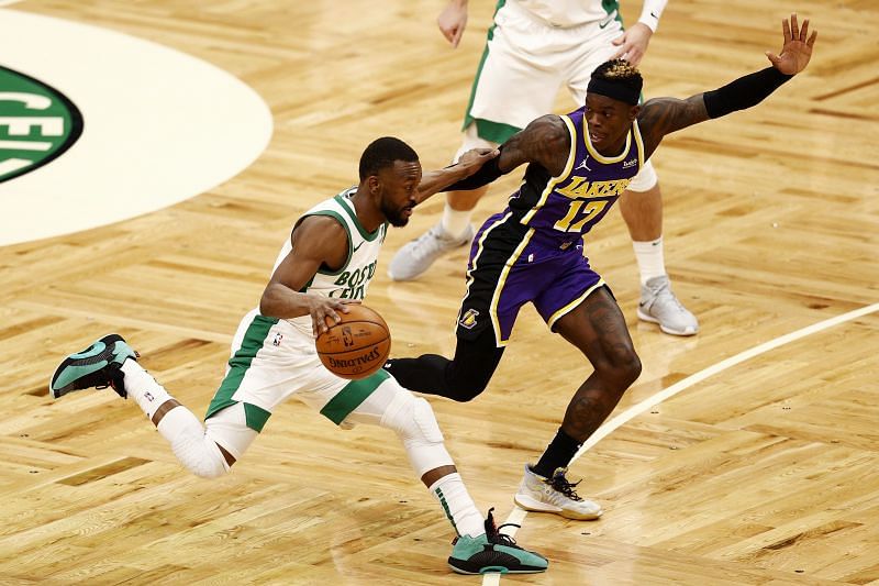 Kemba Walker #8 drives towards the basket past Dennis Schroder #17 