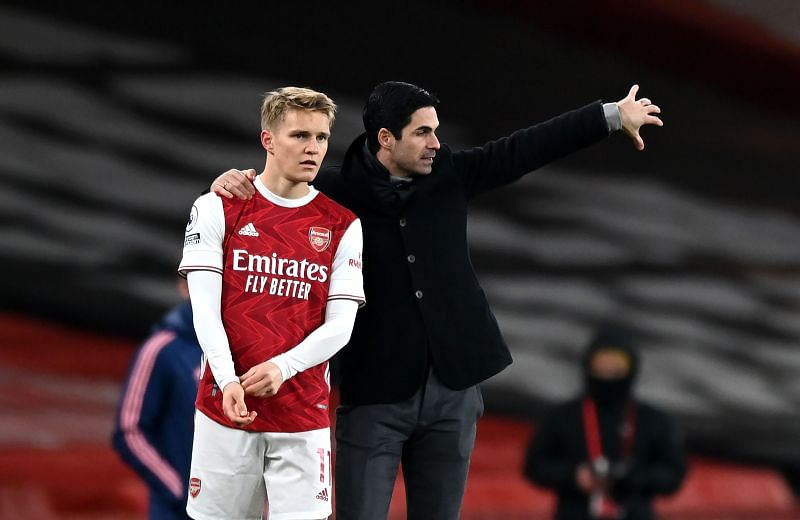 Martin Odegaard (L) and Mikel Arteta