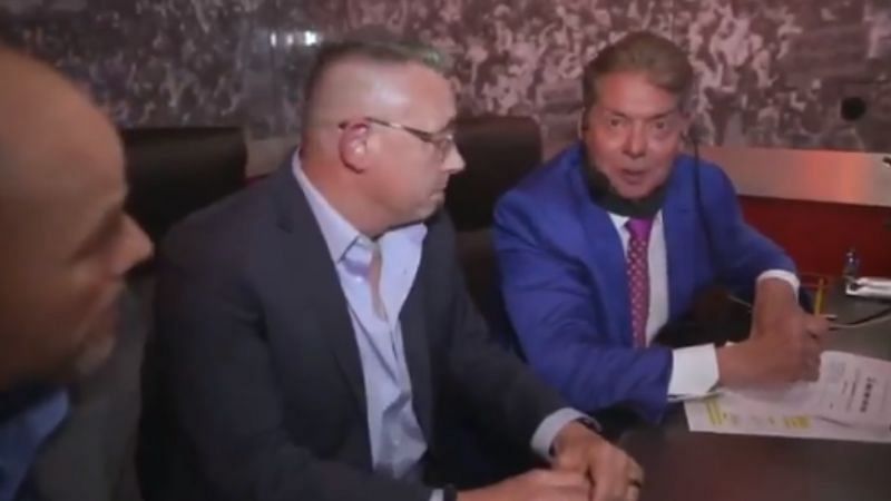 Adam Pearce, Michael Cole, and Vince McMahon