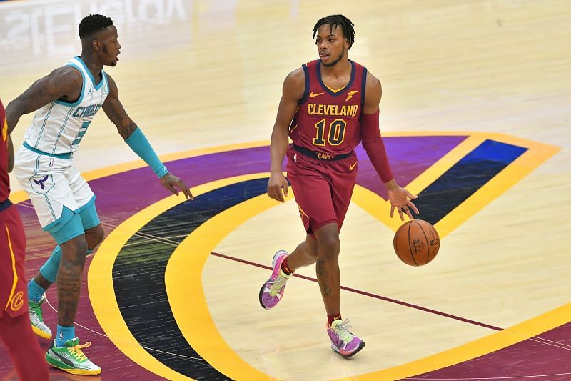 Darius Garland #10 of the Cleveland Cavaliers drives around Terry Rozier #3 of the Charlotte Hornets