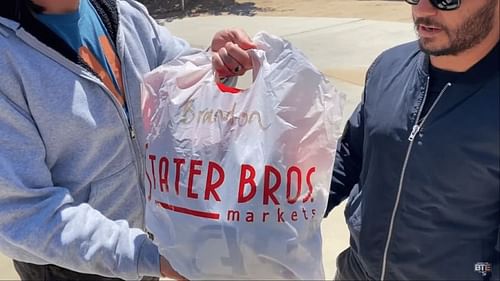 The Young Bucks with the trash bag for Brandon Cutler