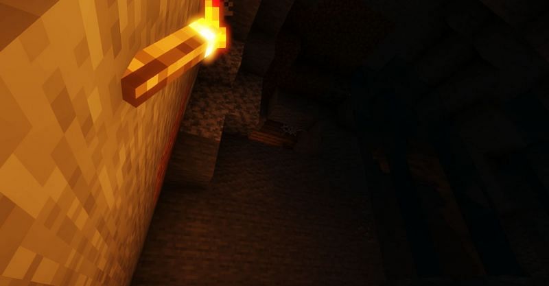 Shown: The entrance to a Mineshaft found in a cave system (Image via Minecraft)