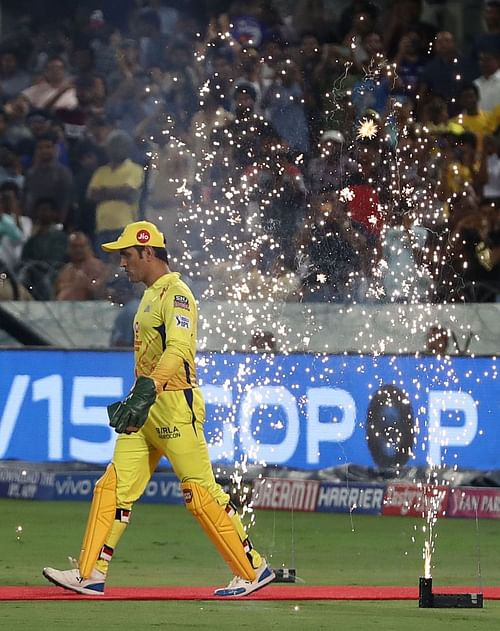 MS Dhoni walks on to the field leading the Chennai Super Kings.