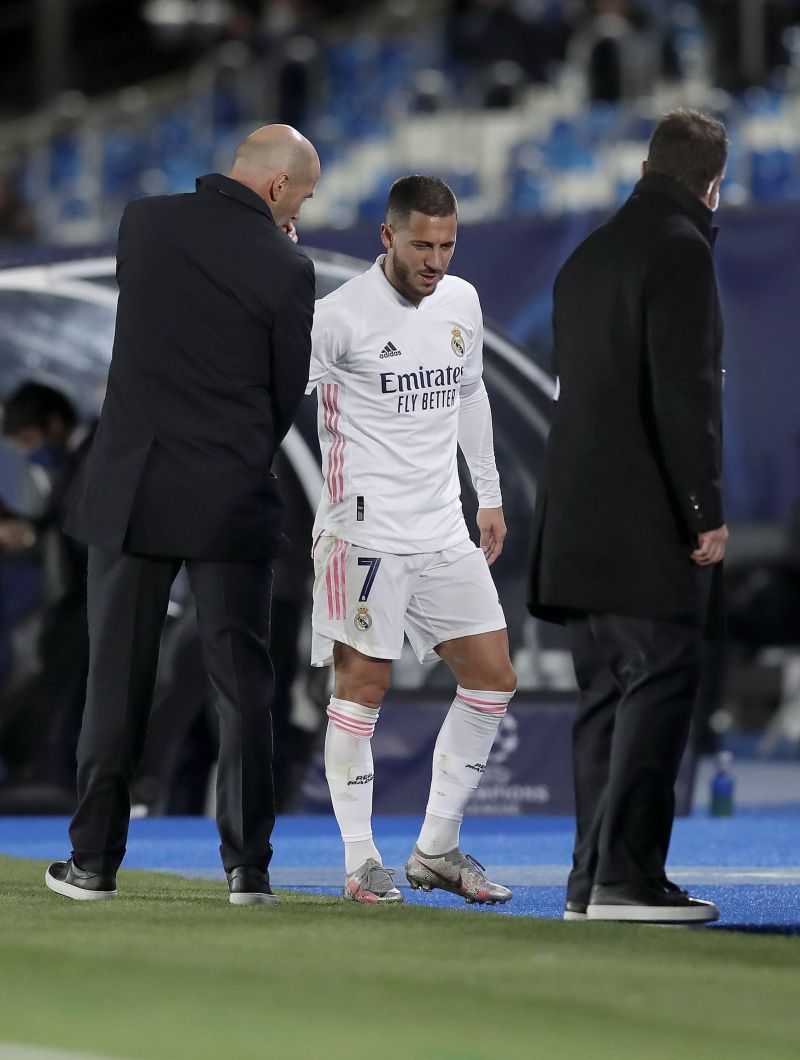 Zinedine Zidane (L) and Eden Hazard