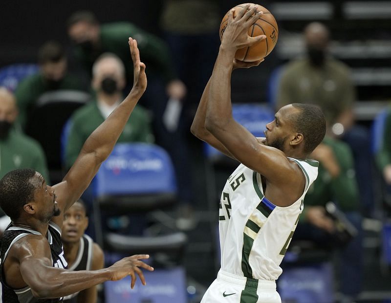 Milwaukee Bucks&#039; Small forward Khris Middleton shoots over Harrison Barnes.