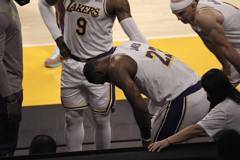 LeBron James gathers himself after he hurt his ankle.