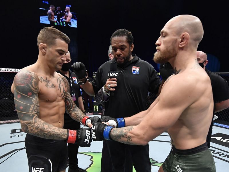 Dustin Poirier and Conor McGregor touch gloves at UFC 257