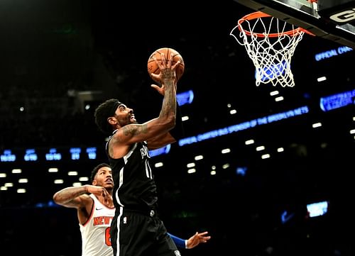 Elfrid Payton #6 watches as Kyrie Irving #11 takes a shot