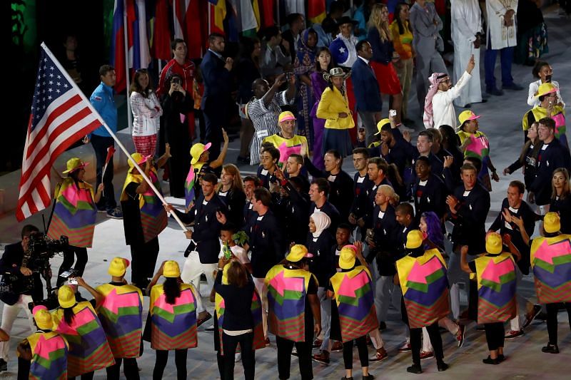 Flag-bearer Michael Phelps of the United States leads the team entering the stadium during the Opening Ceremony of the Rio 2016 Olympic Games in Rio de Janeiro, Brazil