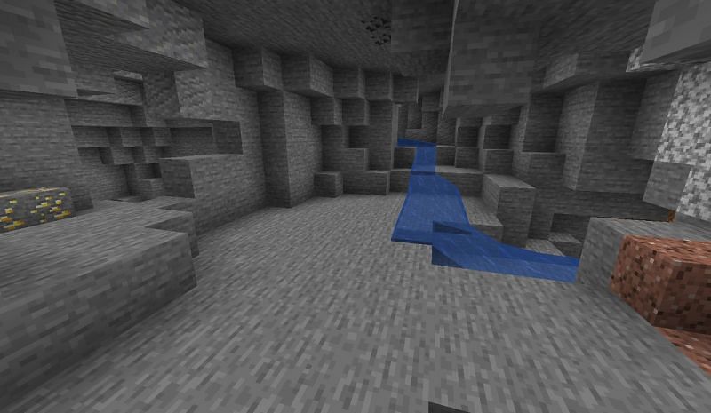 Mushrooms will be seen around the well-lit areas of a cave, such as near lava (Image via Minecraft Fandom)