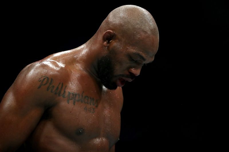 Why was Jon Jones suspended and stripped of his title?