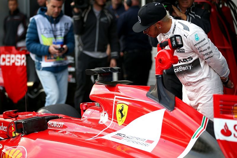 Lewis Hamilton looks at Sebastian Vettel&#039;s Ferrari in Parc Ferme after qualifying for the 2015 Russian GP. Photo: Dan Istitene/Getty Images.