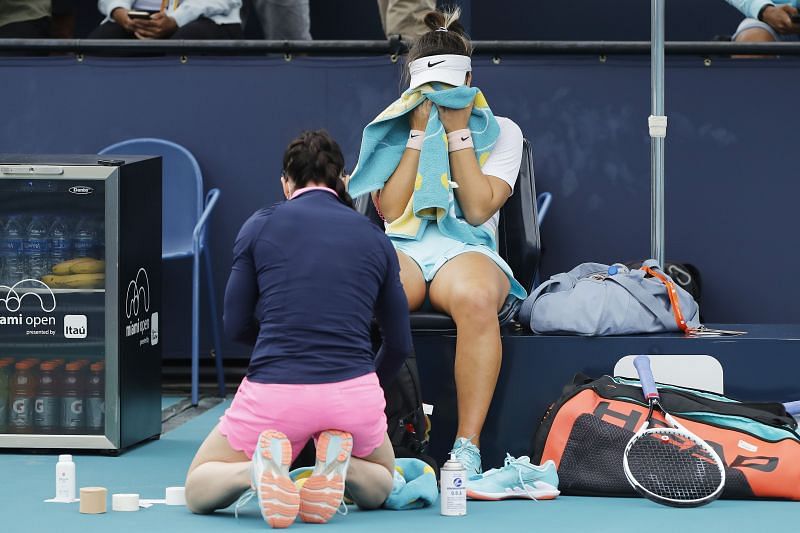 Bianca Andreescu recieiving treatment for her injury during the final against Ashleigh Barty