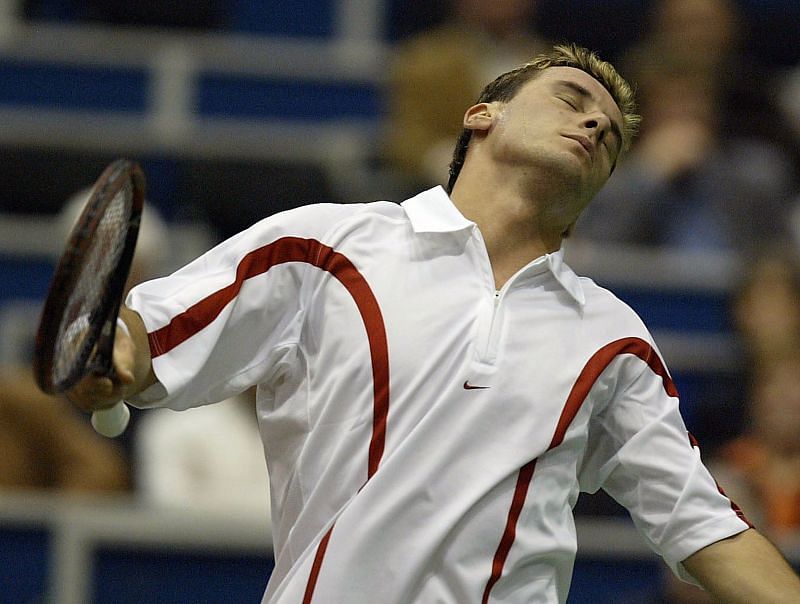 Andrei Pavel in action against Roger Federer at the ABN AMRO 2004 World Tennis Tournament