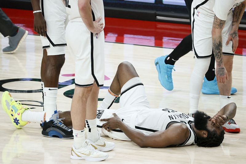 James Harden #13 reacts after falling on the floor.