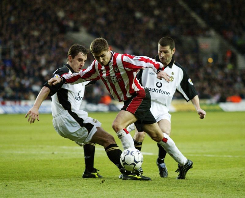 Gary Neville and Denis Irwin (in white) for Manchester United