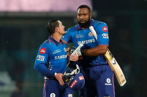 Quinton de Kock celebrates the win with Kieron Pollard.