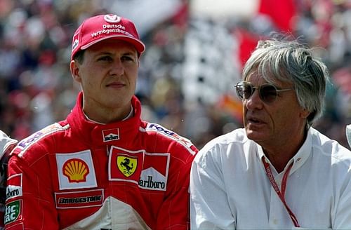 Michael Schumacher with Bernie Ecclestone before the 2000 Hungarian Grand Prix. Photo: Mark Thompson /Allsport.