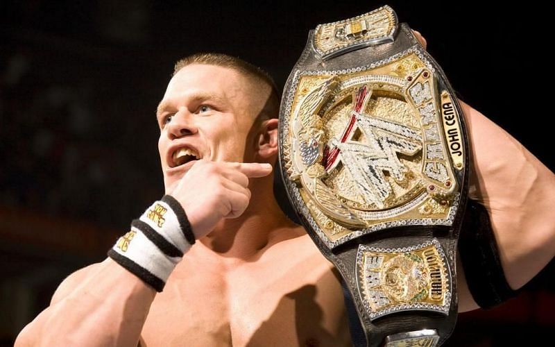 John Cena with his WWE Championship spinner title