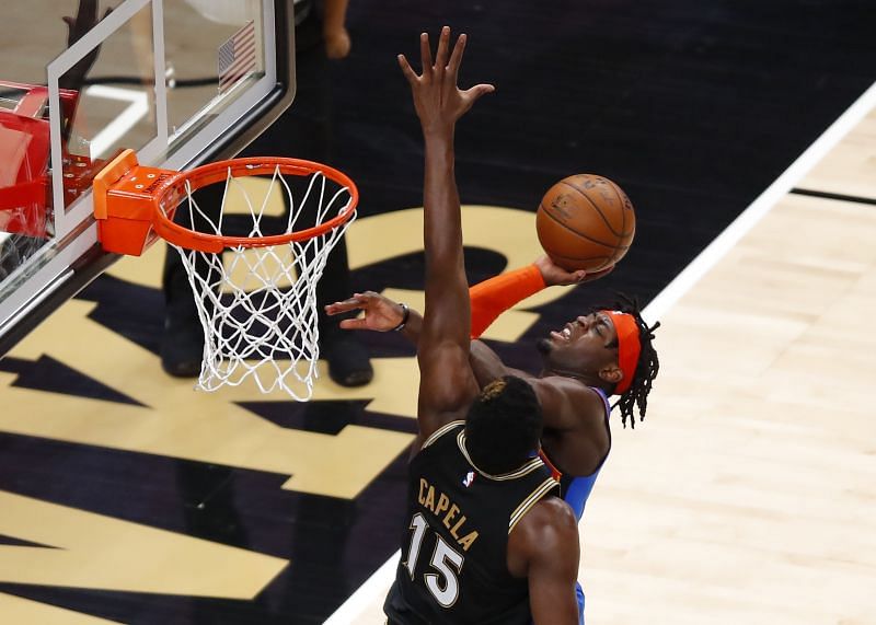 Luguentz Dort #5 goes up for a shot against Clint Capela #15.