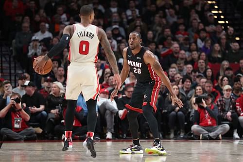 Andre Iguodala (#28) of the Miami Heat defends against Damian Lillard (#0) of the Portland Trail Blazers.