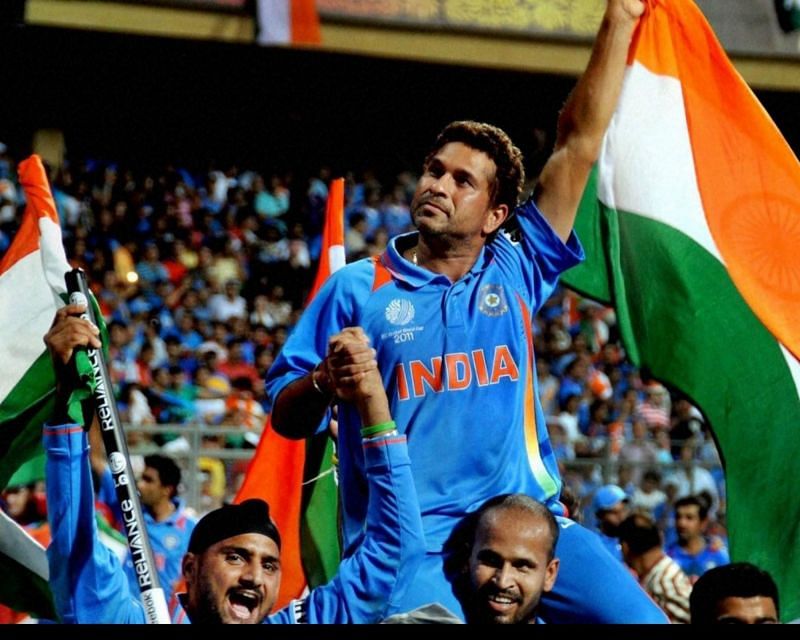 Sachin Tendulkar celebrates with teammates after winning the 2011 Cricket World Cup.