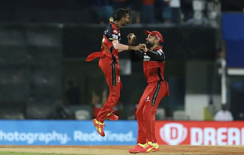 Virat Kohli (right) celebrates the wicket of SRH batsman Abdul Samad with Shahbaz Ahmed. (Photo: BCCI)