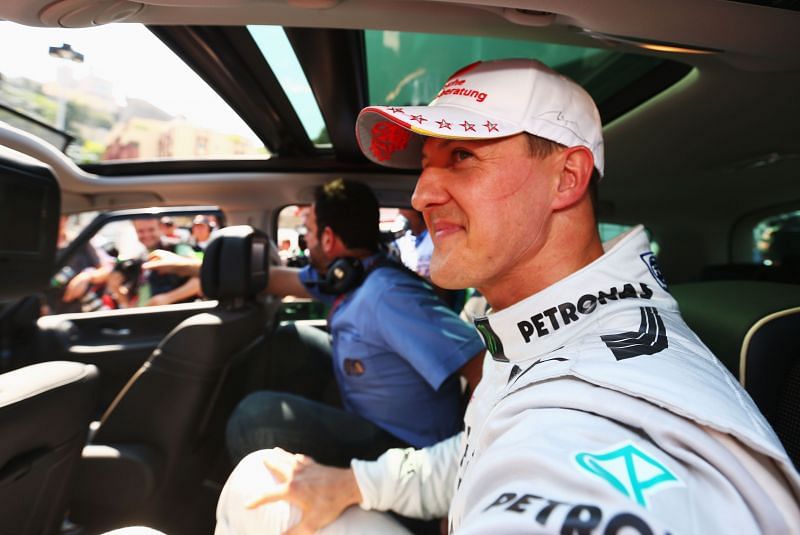 Michael Schumacher smiles after setting the fastest time for the 2012 Monaco Grand Prix (Photo by Paul Gilham/Getty Images)