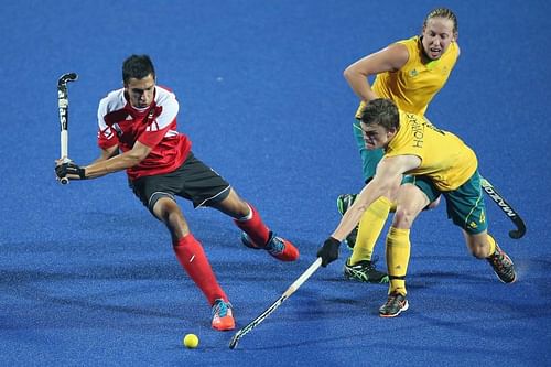 Australia and Canada (red) in action during a Hockey5s match at 2014 Summer Youth Olympic Games