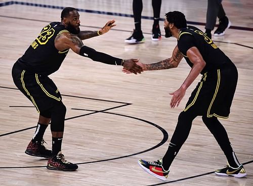 LeBron James #23 and Anthony Davis #3 react during the fourth quarter against the Houston Rockets 