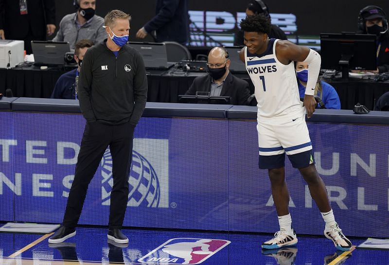 Minnesota Timberwolves rookie Anthony Edwards talking to Warriors coach Steve Kerr.