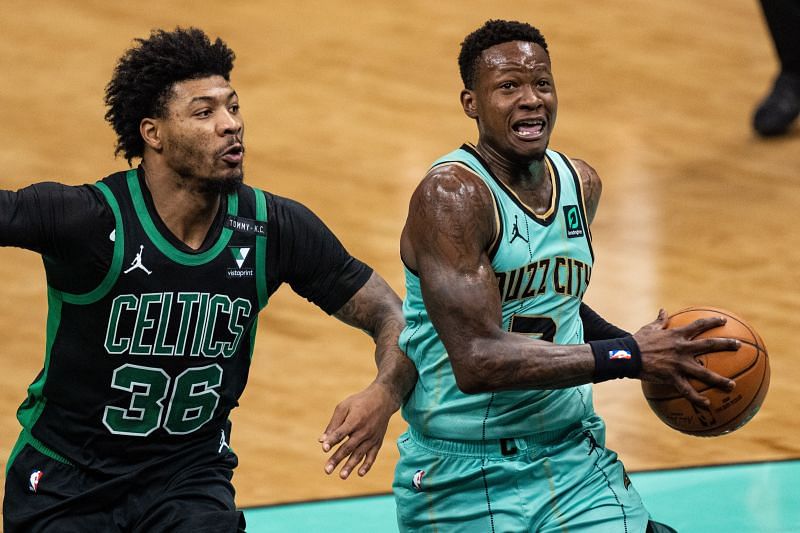 Terry Rozier (#3) of the Charlotte Hornets drives to the basket against Marcus Smart (#36) of the Boston Celtics