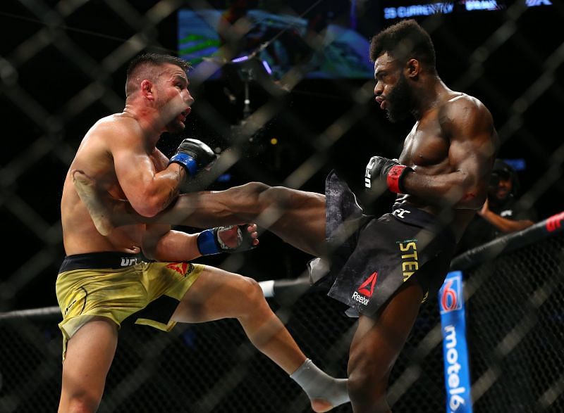 Aljamain Sterling (right) kicks Pedro Munhoz (left) UFC 238