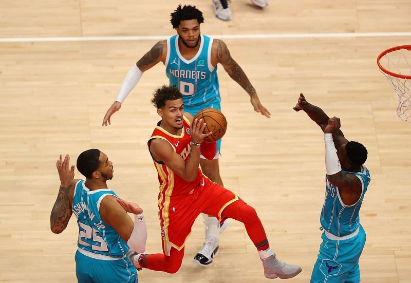 Trae Young of the Atlanta Hawks drives to the basket against the Charlotte Hornets.