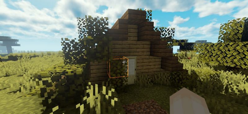 A house with leaves around it (Image via Minecraft)