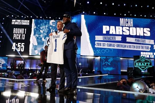 Penn State linebacker Micah Parsons poses on stage with NFL Commissioner Roger Goodell after the Dallas Cowboys selected Parsons with the 12th overall pick in NFL Draft on April 29, 2021.