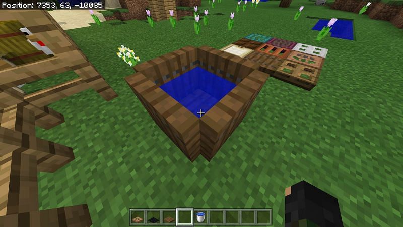 While barrels are actual blocks in Minecraft, you can use trapdoors to make a barrel that looks much like a barrel full of water.