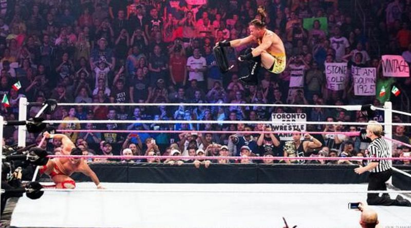 Rob Van Dam flying through the air to deliver the Van-Terminator