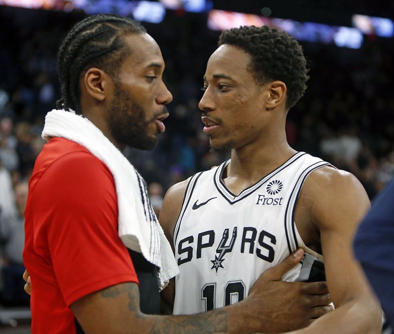 DeMar DeRozan (#10) greets Kawhi Leonard (#2)