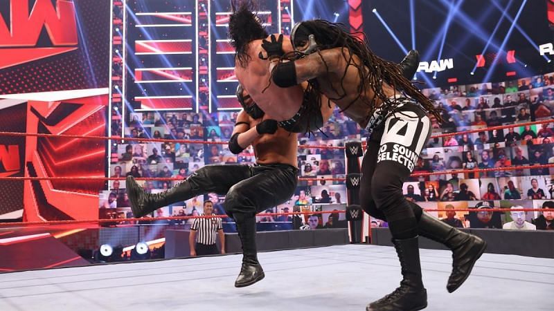 Mace and T-BAR laying the SmackDown on Drew McIntyre