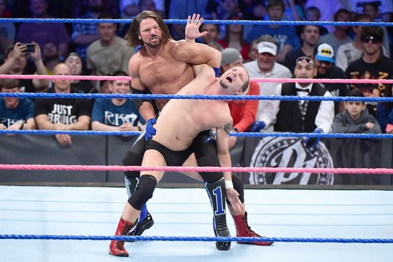 AJ Styles performing an abdominal stretch on Ellsworth.