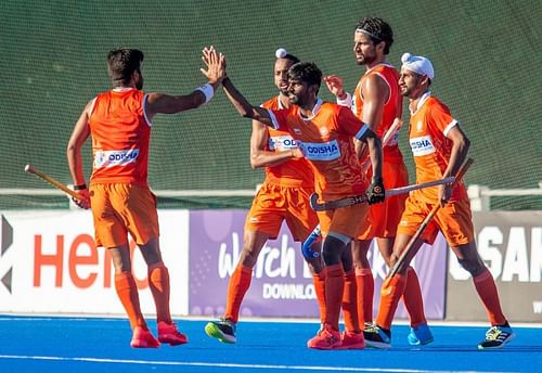 India men's hockey team players celebrate a goal against Argentina. (Source: HI)